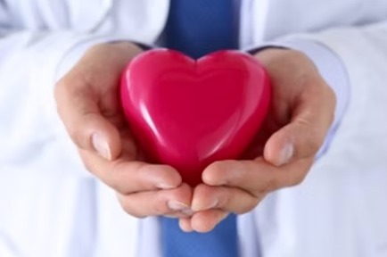 Hands holding a red heart